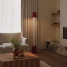 The caynon Gio Floor Light from Gantri with the white rod option in a lounge area for entertaining.