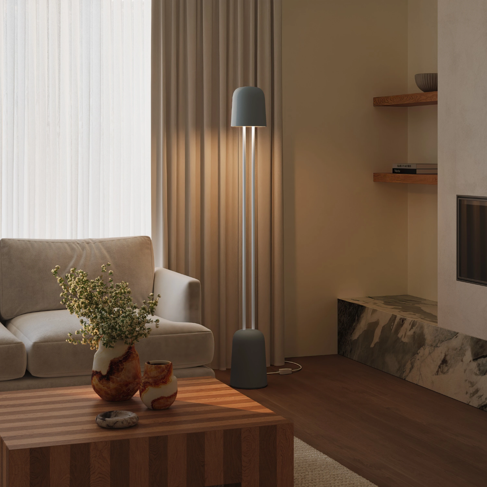 The fog Gio Floor Light from Gantri with the white rod option in a lounge area for entertaining.