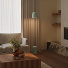 The meadow Gio Floor Light from Gantri with the chrome rod option in a family space beside a sofa.