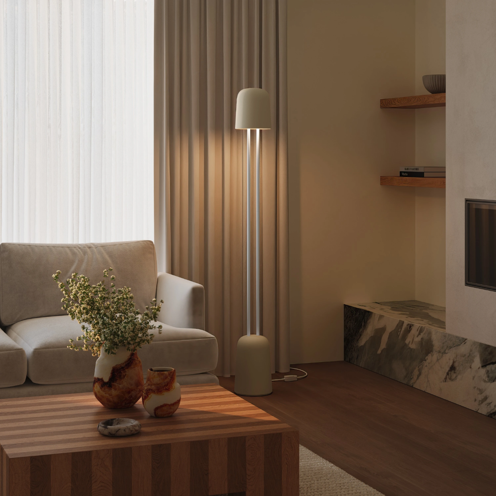 The sand Gio Floor Light from Gantri with the white rod option in a lounge area for entertaining.