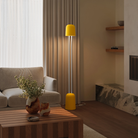 The sunrise Gio Floor Light from Gantri with the white rod option in a lounge area for entertaining.