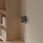 The fog Gio Wall Light from Gantri in a home office.