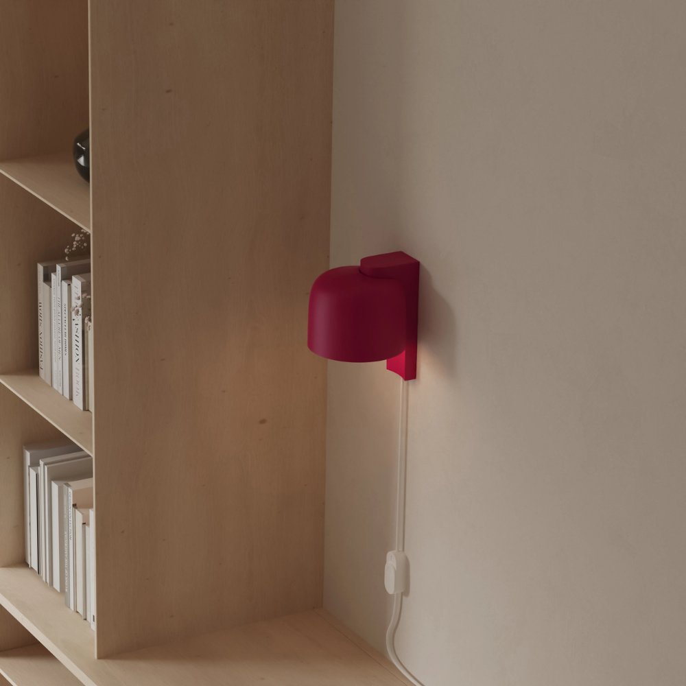 The hibiscus Gio Wall Light from Gantri in a home office.