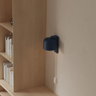 The midnight Gio Wall Light from Gantri in a home office.