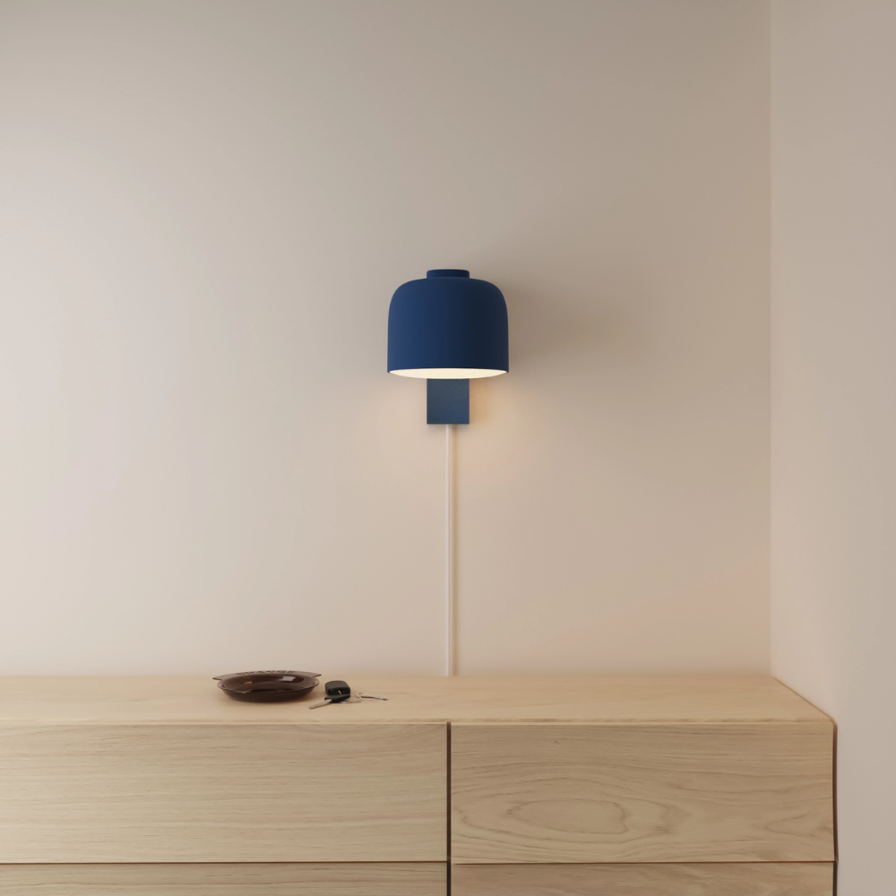 The midnight Gio Wall Light from Gantri in a primary bedroom.