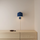 The midnight Gio Wall Light from Gantri in a primary bedroom.