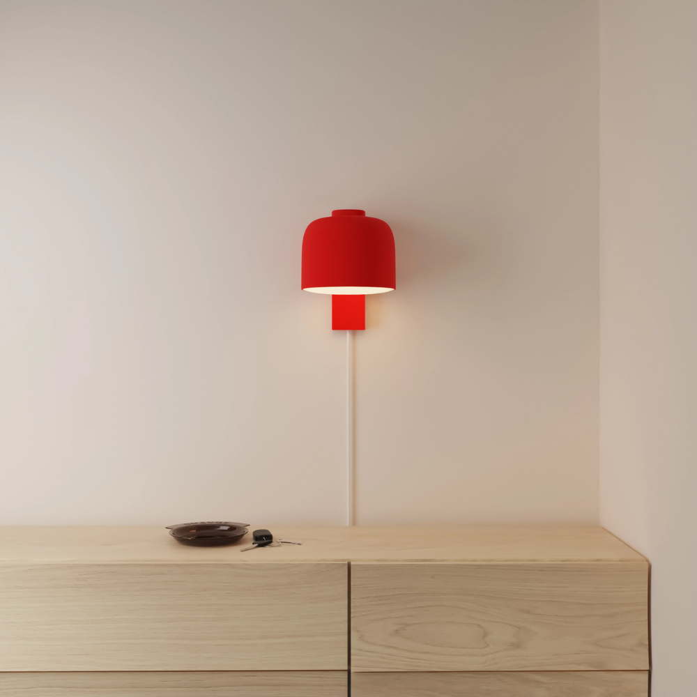 The poppy Gio Wall Light from Gantri in a primary bedroom.