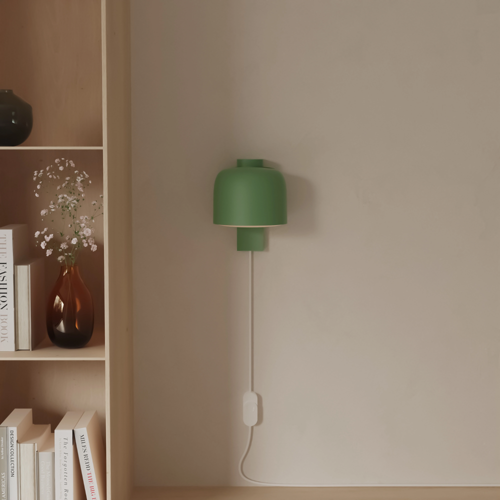 The sage Gio Wall Light from Gantri in a living room.