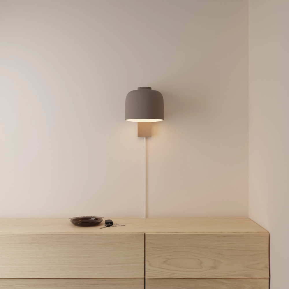 The smoke Gio Wall Light from Gantri in a primary bedroom.