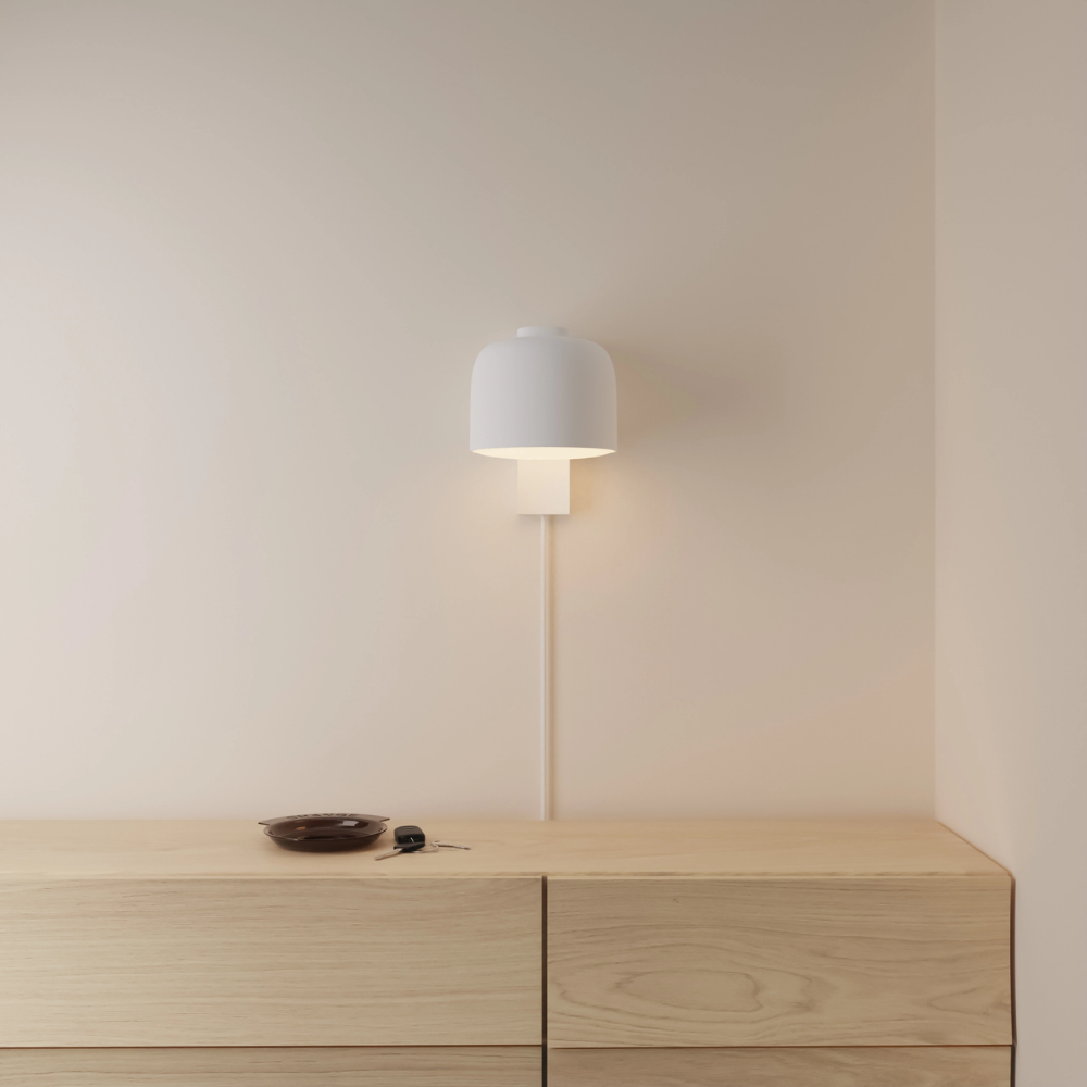 The snow Gio Wall Light from Gantri in a primary bedroom.