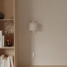The stone Gio Wall Light from Gantri in a living room.