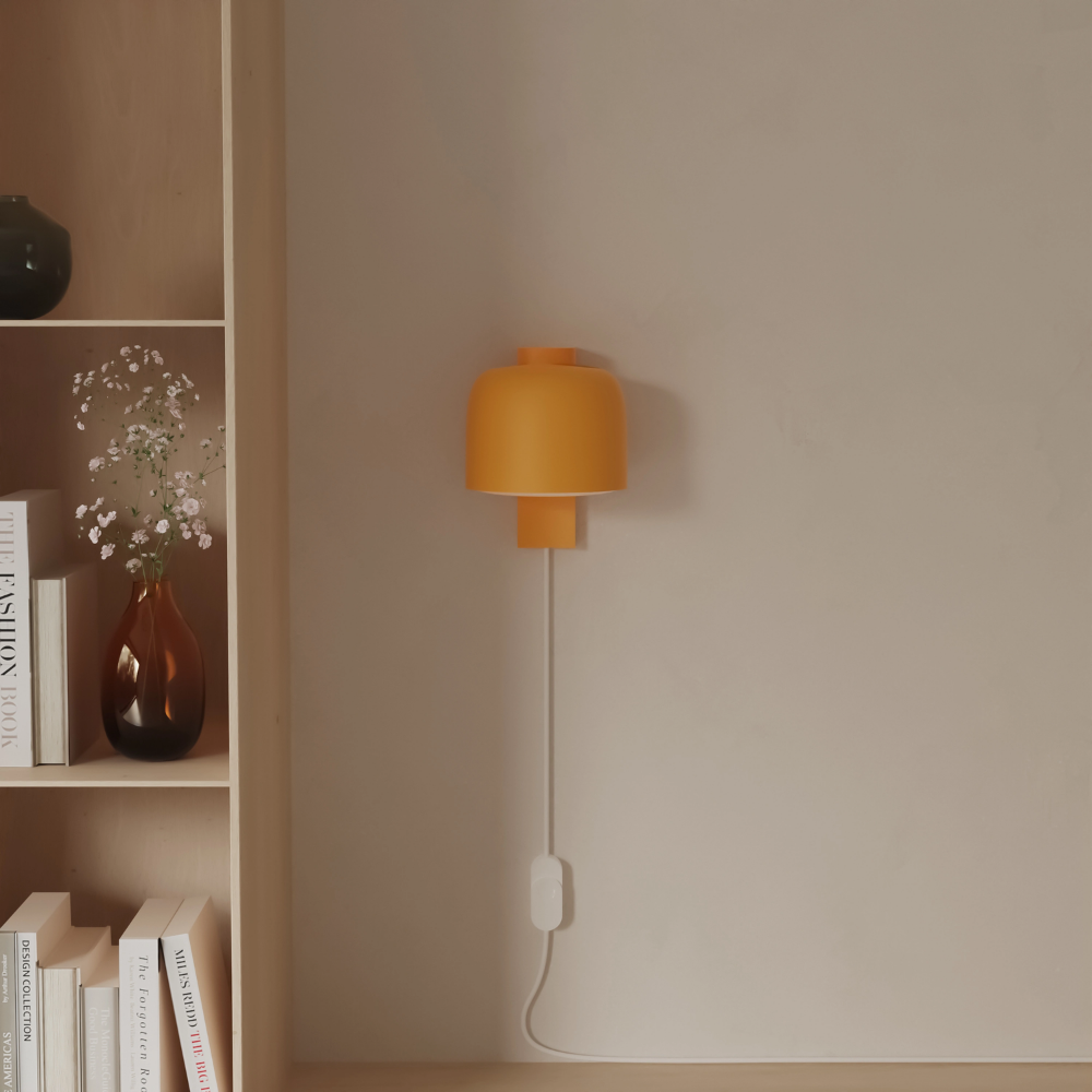 The sunrise Gio Wall Light from Gantri in a living room.