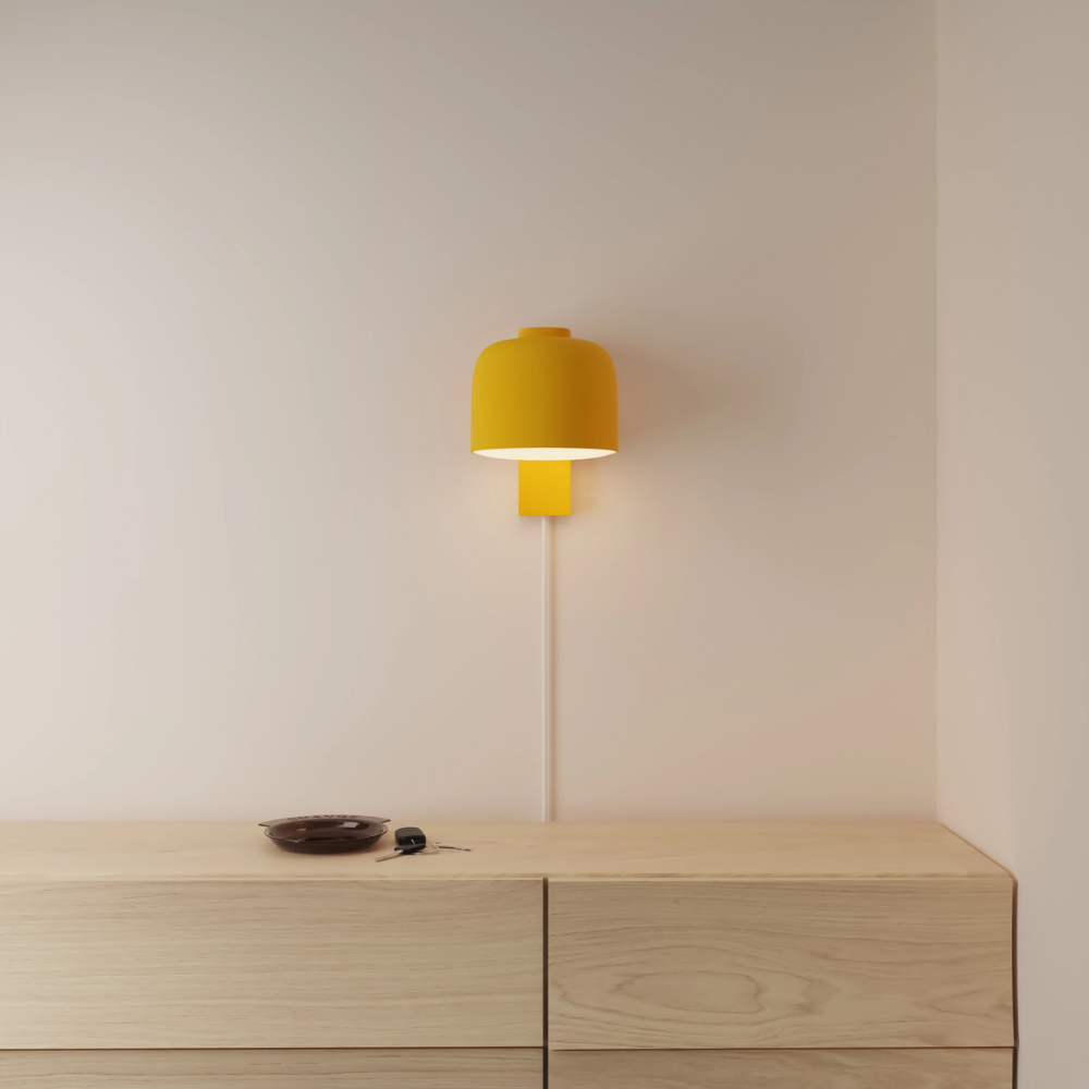 The sunrise Gio Wall Light from Gantri in a primary bedroom.