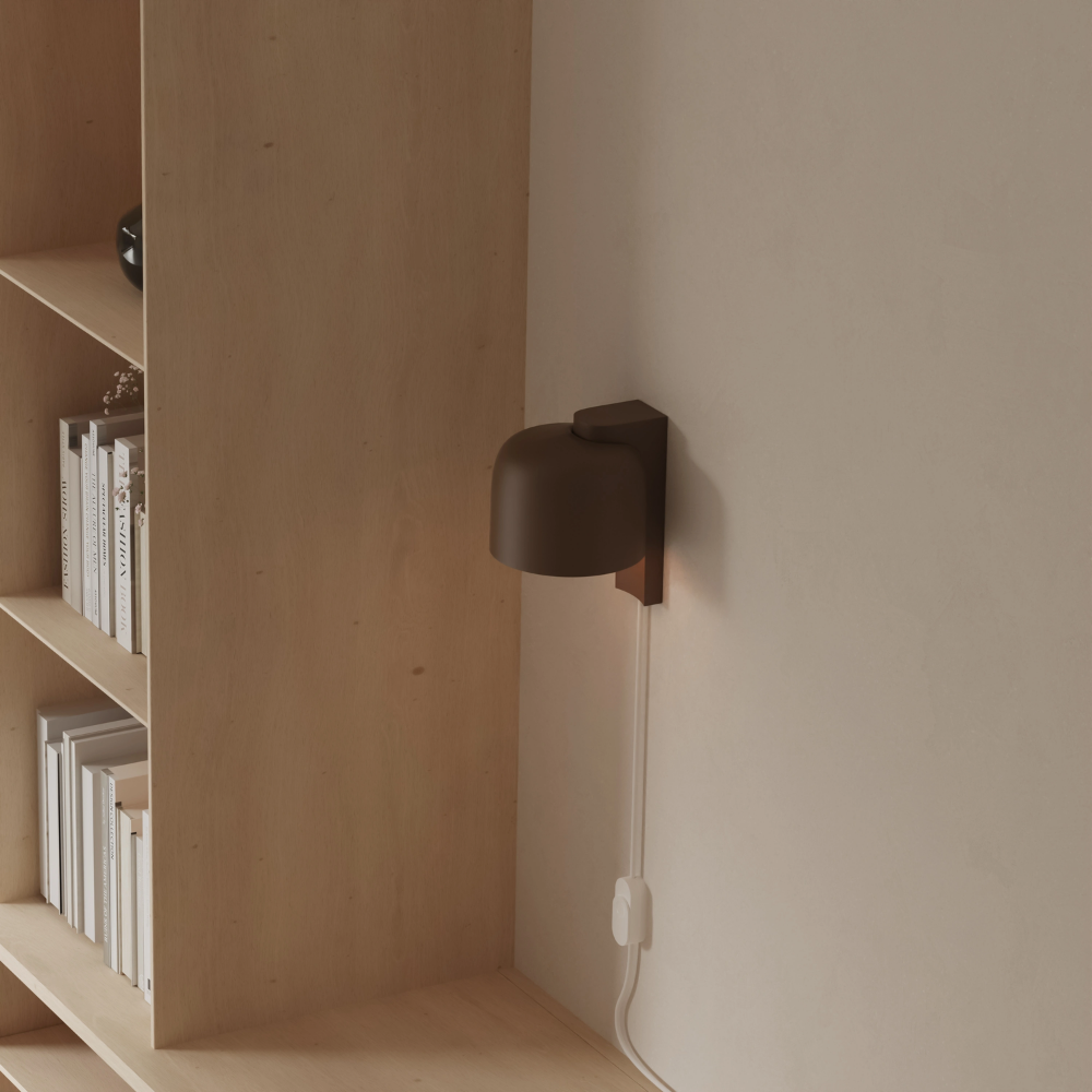 The walnut Gio Wall Light from Gantri in a home office.