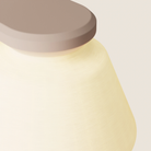The coral Granada Wall Light from Gantri close up.