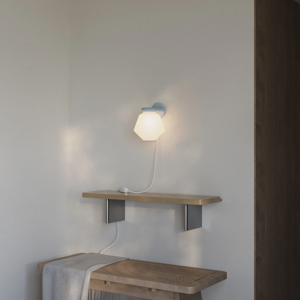 The fog Granada Wall Light from Gantri in a living room.