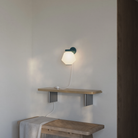 The forest Granada Wall Light from Gantri in a living room.