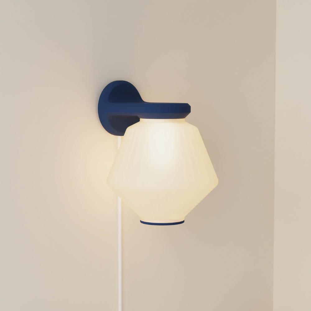 The midnight Granada Wall Light from Gantri.