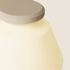 The peach Granada Wall Light from Gantri close up.