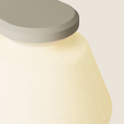 The sand Granada Wall Light from Gantri close up.