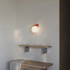 The sedona Granada Wall Light from Gantri in a living room.
