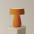 The persimmon Hula Table Light from Gantri.