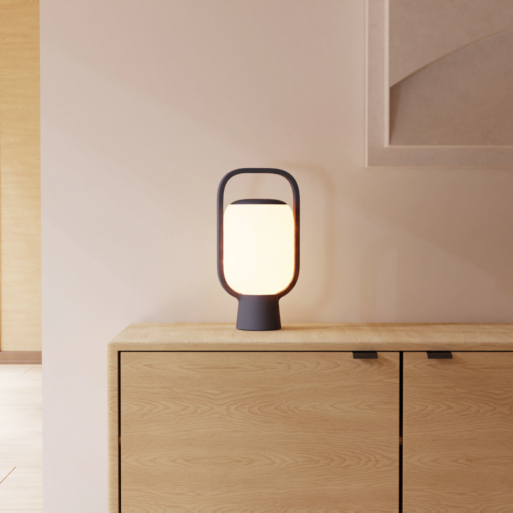 The carbon Kero Table Light from Gantri in a family area.