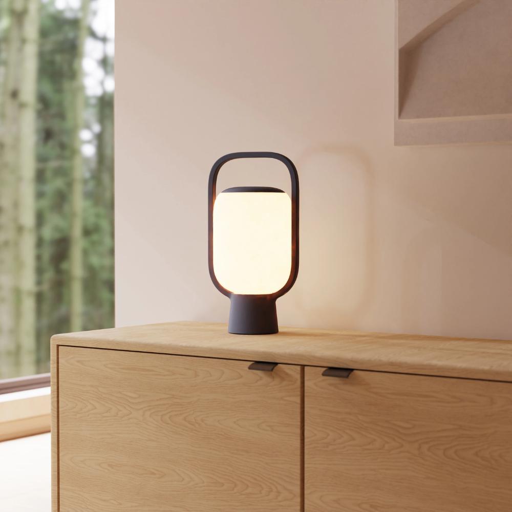 The carbon Kero Table Light from Gantri in a living room.