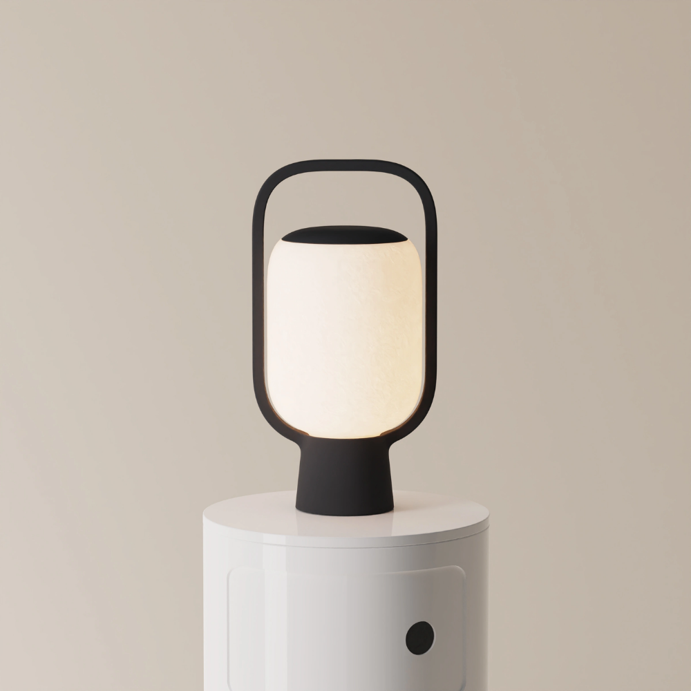The carbon Kero Table Light from Gantri in a studio.