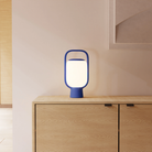 The cobalt Kero Table Light from Gantri in a family area.