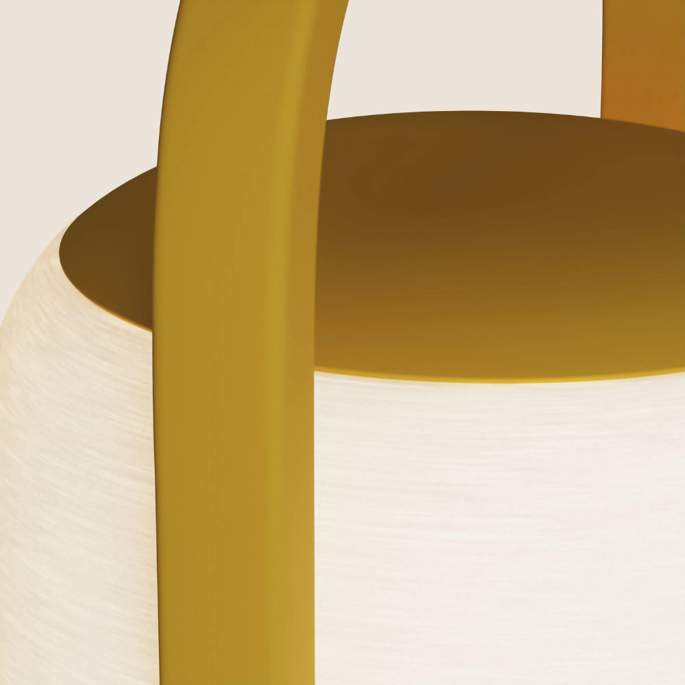 The mustard Kero Table Light from Gantri close up.