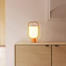 The mustard Kero Table Light from Gantri in a family area.