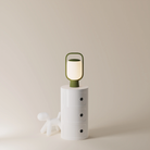 The olive Kero Table Light from Gantri in a home office.