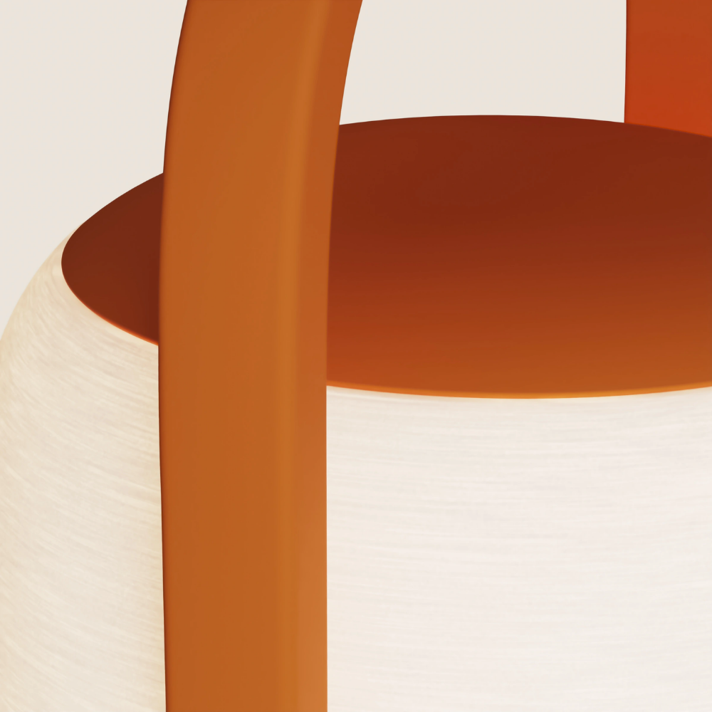 The persimmon Kero Table Light from Gantri close up.