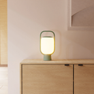 The sage Kero Table Light from Gantri in a family area.
