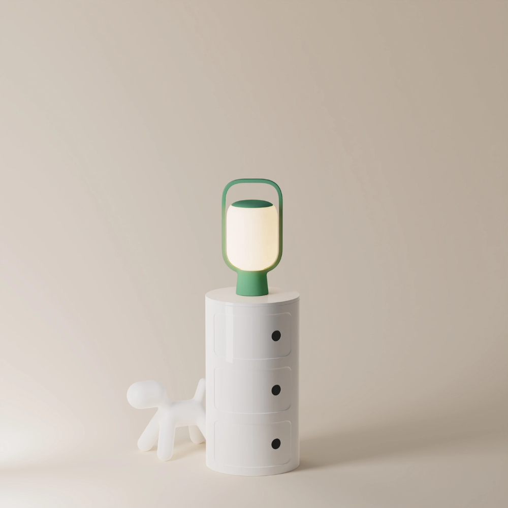 The sage Kero Table Light from Gantri in a home office.