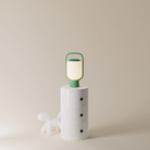 The sage Kero Table Light from Gantri in a home office.