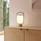 The sage Kero Table Light from Gantri in a living room.