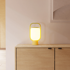 The sprout Kero Table Light from Gantri in a family area.