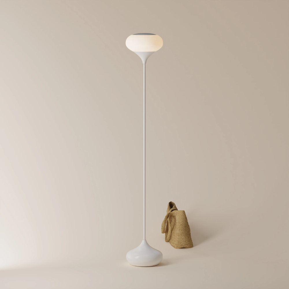 The glossy snow Kobble Floor Light from Gantri with the white rod option in a lounge space.