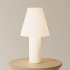 The Pleat Table Light from Gantri in a primary bedroom.
