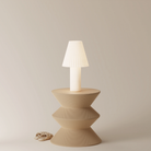 The Pleat Table Light from Gantri in a studio.