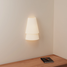 The Pleat Wall Sconce from Gantri in a home office.