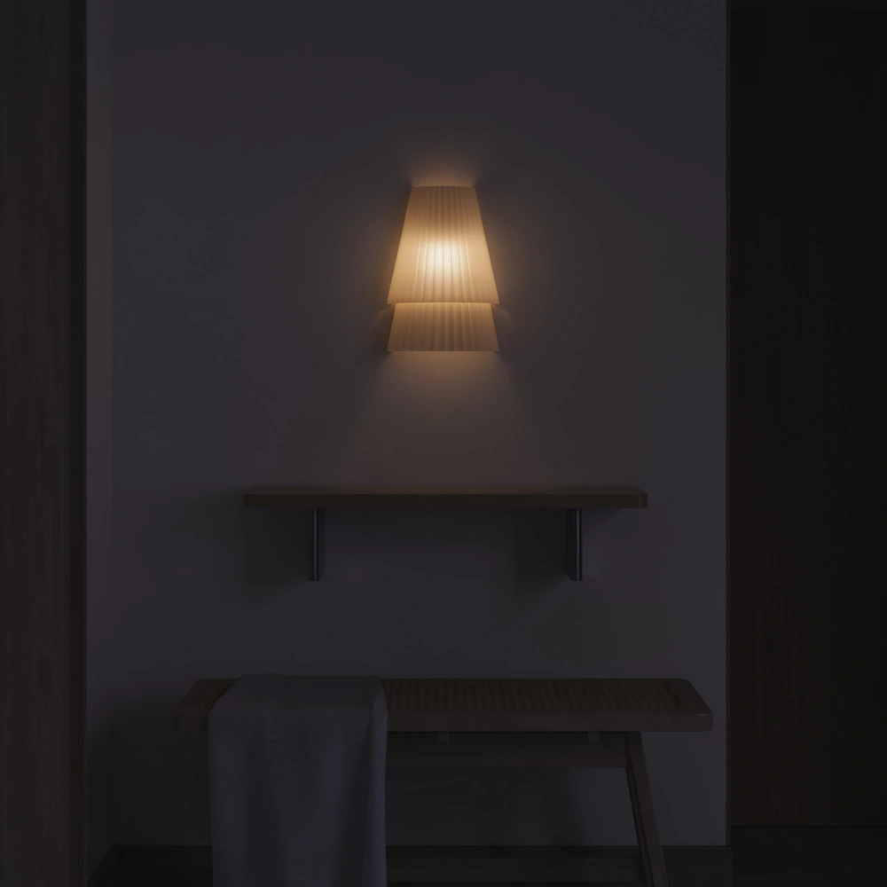 The Pleat Wall Sconce from Gantri lighting up a living space.