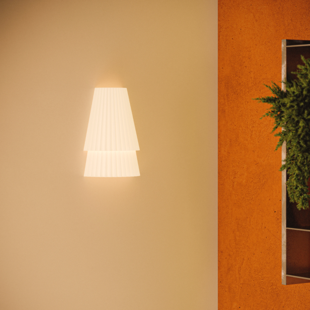 The Pleat Wall Sconce from Gantri in a living room.