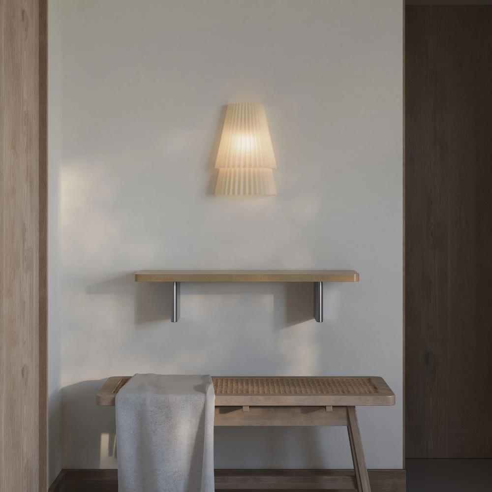 The Pleat Wall Sconce from Gantri in a primary bedroom.