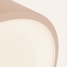 The coral Vitria Flush Mount from Gantri close up.