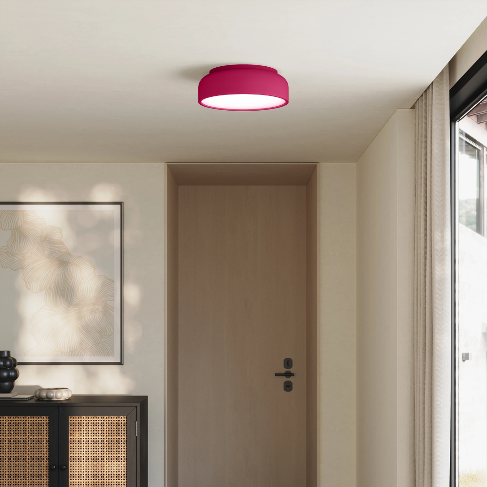 The hibiscus Vitria Flush Mount from Gantri in a living room on the ceiling.
