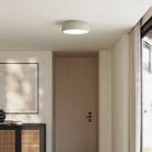 The meadow Vitria Flush Mount from Gantri in a living room on the ceiling.