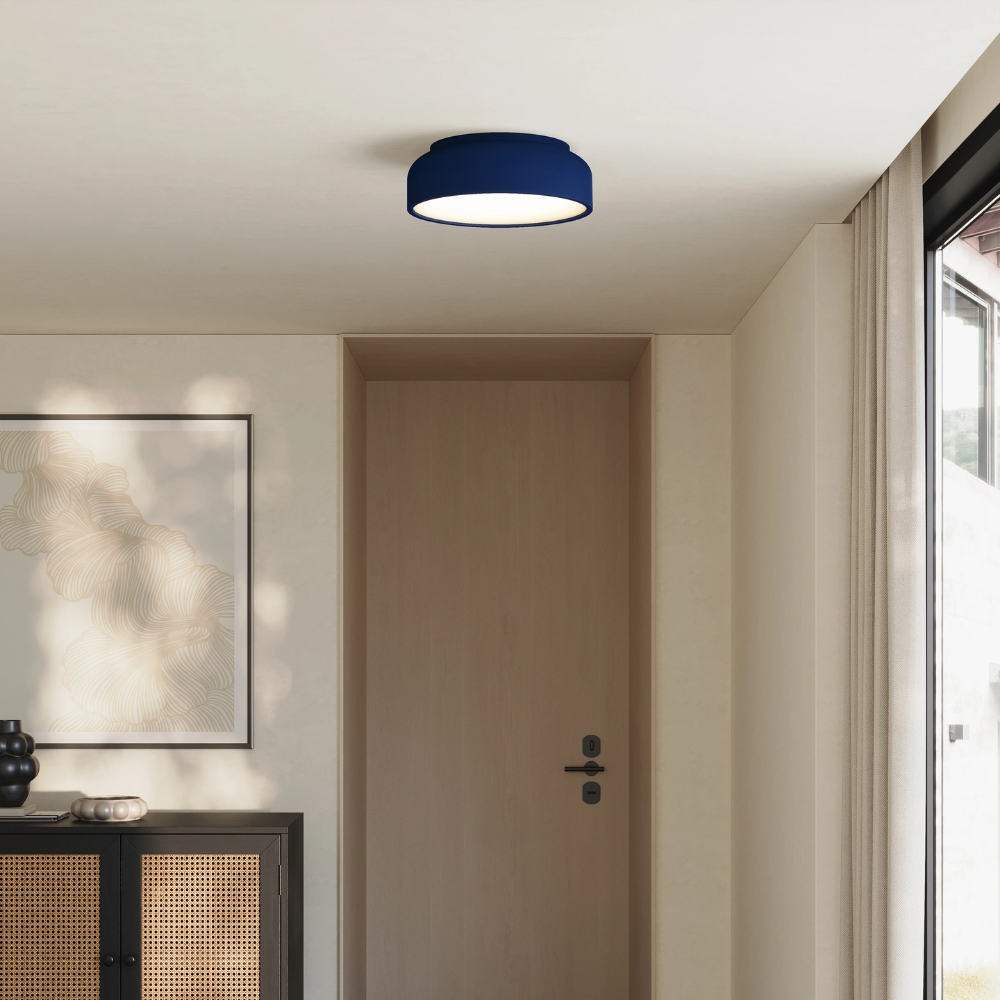 The midnight Vitria Flush Mount from Gantri in a living room on the ceiling.